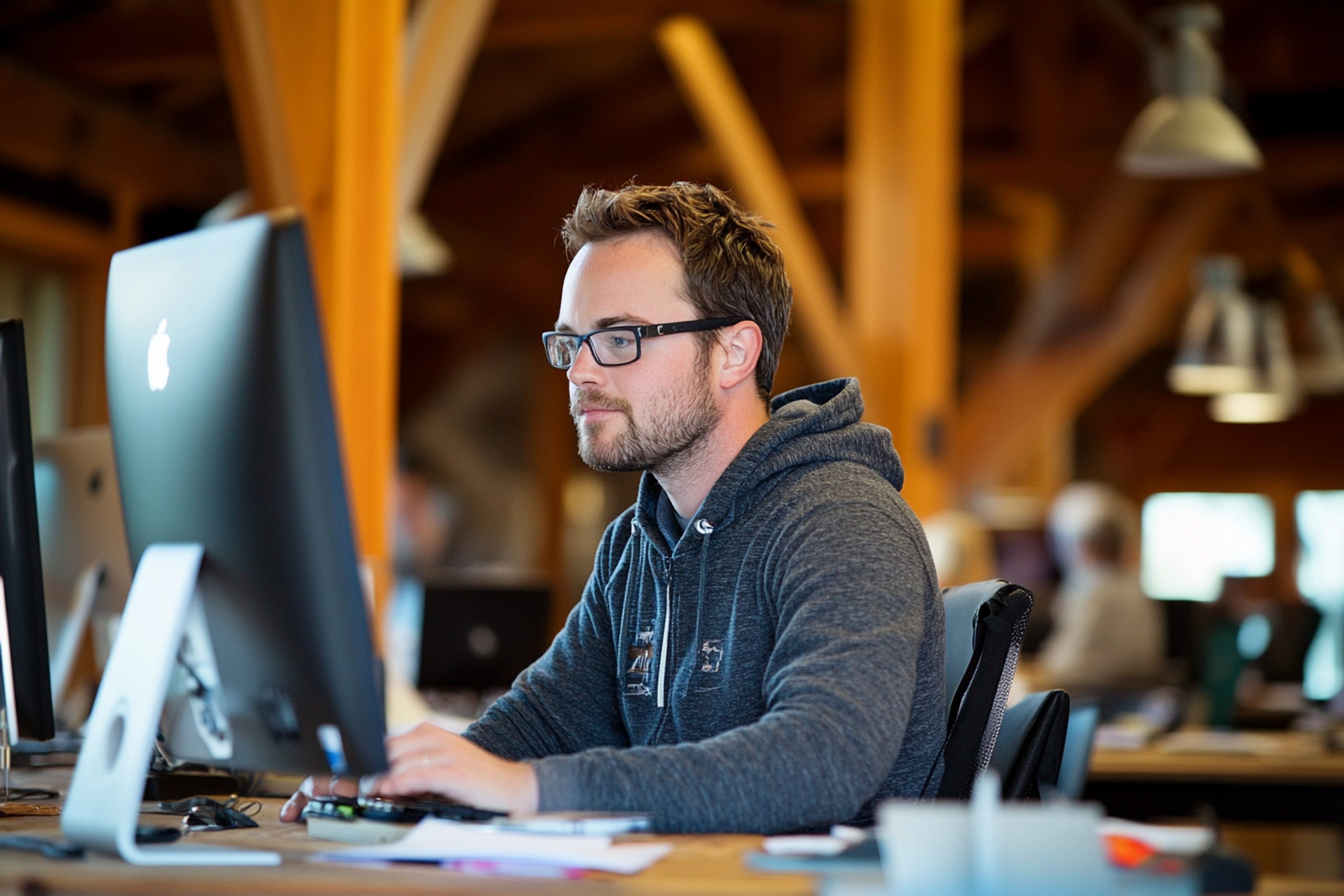 man-works-computer-coworking-space